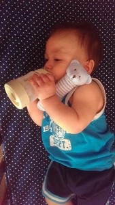photo provided by Stacey V. Teddy enjoying his Mixie bottle and Angel Dear rattle from SpringFest Swag Bag giveaway 01